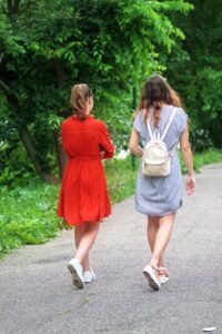 Girls walking along a footpath